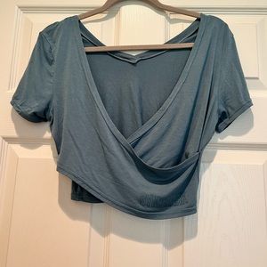 Gymshark Womens Small Blue Studio Workout Crop Top Shirt- Logo Spell-Out Twist.